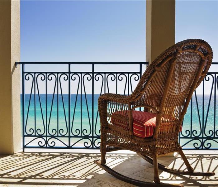 patio chair on balcony overlooking ocean