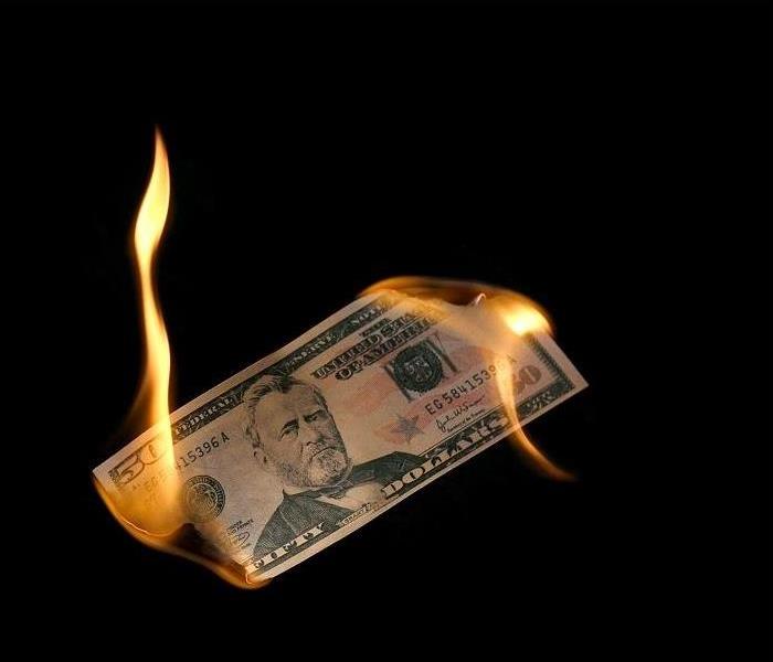 Fifty dollar bill burning on both ends